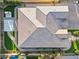 Bird's eye view of a home showing the detailed roof, landscaping, and patio area with artificial turf at 12539 W Tuckey Ln, Glendale, AZ 85307