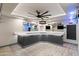 Basement wet bar with white counters, dark cabinets, and recessed lighting. Perfect for entertaining guests at 12539 W Tuckey Ln, Glendale, AZ 85307