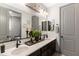 Bathroom featuring dual sinks, modern fixtures, and stylish decor at 12539 W Tuckey Ln, Glendale, AZ 85307