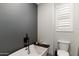 Modern bathroom with a sleek soaking tub and textured wall at 12539 W Tuckey Ln, Glendale, AZ 85307