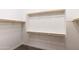 Spacious walk-in closet with wooden rails and ample shelving for optimal storage and organization at 12539 W Tuckey Ln, Glendale, AZ 85307
