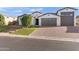 Attractive single-Gathering home with a three-car garage and well-maintained desert landscaping at 12539 W Tuckey Ln, Glendale, AZ 85307