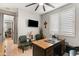 Dedicated home office featuring a large desk and two comfortable chairs at 12539 W Tuckey Ln, Glendale, AZ 85307