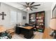 Home office with built-in shelving and natural light at 12539 W Tuckey Ln, Glendale, AZ 85307