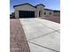 Charming single-story home featuring a two-car garage and low maintenance desert landscaping at 13699 S Durango Rd, Arizona City, AZ 85123