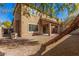 This backyard features desert landscaping and a covered patio at 1421 E Hopkins Rd, Gilbert, AZ 85295