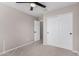 Bedroom with neutral carpet and walls and a closet with sliding doors at 1421 E Hopkins Rd, Gilbert, AZ 85295