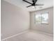 Bedroom with neutral carpet and walls and a large exterior view through window at 1421 E Hopkins Rd, Gilbert, AZ 85295
