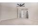 Spacious bedroom featuring neutral walls and carpet, with several doorways at 1421 E Hopkins Rd, Gilbert, AZ 85295