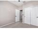 Bedroom with neutral carpet and walls and a closet with sliding doors at 1421 E Hopkins Rd, Gilbert, AZ 85295