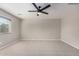 Spacious bedroom featuring neutral walls and carpet, with a modern ceiling fan at 1421 E Hopkins Rd, Gilbert, AZ 85295