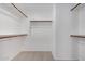 Walk in closet with carpet and wooden rods for ample storage at 1421 E Hopkins Rd, Gilbert, AZ 85295