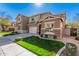 Charming two-story home with a well-manicured lawn and a two-car garage on a sunny day at 1421 E Hopkins Rd, Gilbert, AZ 85295