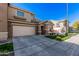 This is a two-story home with a two-car garage and desert landscaping at 1421 E Hopkins Rd, Gilbert, AZ 85295