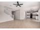 Bright, open-concept living room with tile flooring and stairs leading to the second floor at 1421 E Hopkins Rd, Gilbert, AZ 85295