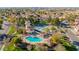 Aerial view of community center with a pool, spa, tennis court, and well-manicured landscaping at 1470 S Villas Ct, Chandler, AZ 85286
