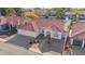 Beautiful aerial view of a lakefront home with a well-manicured lawn and a red tile roof at 1470 S Villas Ct, Chandler, AZ 85286