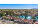 Beautiful aerial view of waterfront homes with tile roofs overlooking a lake under a clear blue sky at 1470 S Villas Ct, Chandler, AZ 85286