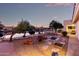 Backyard with a charming garden, lovely water view at twilight, and ambient lighting creating a peaceful atmosphere at 1470 S Villas Ct, Chandler, AZ 85286
