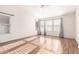 Bright bedroom featuring wood floors, large windows and neutral color palette at 1470 S Villas Ct, Chandler, AZ 85286