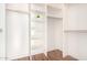 Walk-in closet with custom shelving and wood floor at 1470 S Villas Ct, Chandler, AZ 85286