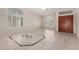 Spacious entryway featuring tile flooring, high ceilings, and a decorative front door at 1470 S Villas Ct, Chandler, AZ 85286