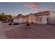 Charming single-story home featuring a three-car garage, desert landscaping and an arched entry at 1470 S Villas Ct, Chandler, AZ 85286