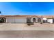 Charming single-story home featuring a three-car garage, desert landscaping and a red tile roof at 1470 S Villas Ct, Chandler, AZ 85286