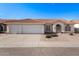 Charming single-story home featuring a three-car garage, desert landscaping and a red tile roof at 1470 S Villas Ct, Chandler, AZ 85286