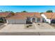 Beautiful single-story home with three car garage and desert landscaping, aerial view at 1470 S Villas Ct, Chandler, AZ 85286