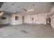Spacious garage with ample storage cabinets, epoxy floor, and room for multiple vehicles at 1470 S Villas Ct, Chandler, AZ 85286