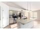 Open kitchen design with granite island, updated appliances, and ample cabinet space at 1470 S Villas Ct, Chandler, AZ 85286
