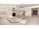 Light-filled living room with fireplace, built-in shelving, tile floors, and an open layout leading to the entrance hall at 1470 S Villas Ct, Chandler, AZ 85286