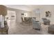 Bright living area featuring tile flooring, a dining table, and comfortable armchairs for relaxing or entertaining at 1470 S Villas Ct, Chandler, AZ 85286