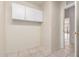 Mud room features tile floors and overhead cabinets for optimal organization at 1470 S Villas Ct, Chandler, AZ 85286