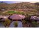 Aerial view of a home nestled in a golf community with scenic mountain views at 16341 E Links Dr, Fountain Hills, AZ 85268