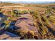 Aerial view of the home showcasing the architecture, tile roof, and desert landscaping at 16341 E Links Dr, Fountain Hills, AZ 85268