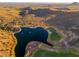 Breathtaking aerial view of a desert golf course with a tranquil lake and scenic surroundings at 16341 E Links Dr, Fountain Hills, AZ 85268