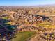 Stunning aerial view of a golf course community, featuring lush green fairways and desert landscaping at 16341 E Links Dr, Fountain Hills, AZ 85268