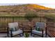 Balcony with comfortable seating overlooking a lush golf course and desert landscape at 16341 E Links Dr, Fountain Hills, AZ 85268
