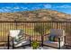 Relaxing balcony with comfortable seating overlooking a lush golf course and desert landscape at 16341 E Links Dr, Fountain Hills, AZ 85268