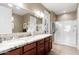 Bright bathroom with double sinks, granite countertops, and a glass-enclosed shower, for spa-like experience at 16341 E Links Dr, Fountain Hills, AZ 85268