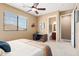 Comfortable bedroom with a view of the attached bathroom and featuring a ceiling fan and carpeted floors at 16341 E Links Dr, Fountain Hills, AZ 85268