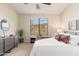Cozy bedroom with a large window offering natural light and views of the surrounding landscape at 16341 E Links Dr, Fountain Hills, AZ 85268