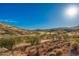 Scenic view of a golf course winding through the desert landscape under a bright, sunny sky at 16341 E Links Dr, Fountain Hills, AZ 85268