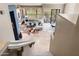 Spacious living room with tile floors, cozy seating, fireplace, and views from large windows and sliding glass door at 16341 E Links Dr, Fountain Hills, AZ 85268