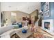 Bright living room with modern decor flowing to the kitchen and staircase at 16341 E Links Dr, Fountain Hills, AZ 85268