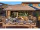 View of the back of the house showcasing the large outdoor deck and seating area at 16341 E Links Dr, Fountain Hills, AZ 85268