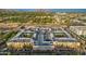 Aerial view of a well-maintained condo complex with lush landscaping, parking, and mountain views at 1701 E Colter St # 191, Phoenix, AZ 85016