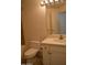 Bathroom featuring white vanity with solid surface countertop, white fixtures, and modern lighting at 1701 E Colter St # 191, Phoenix, AZ 85016